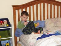 02-Kenny_went_to_his_room_to_read_a_book_all_by_himself_while_sitting_in_bed