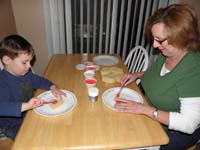 03-Kenny_and_Grammy_putting_frosting_on_cookies