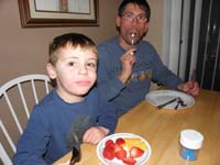 06-Hmmm-Kenny's_done_with_his_cookie_and_wants_more_food-he_gets_fruit-Daddy_licks_the_icing