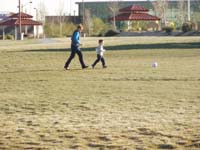 10-Kenny_kicking_the_soccer_ball_with_Mommy