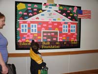 19-Kenny_points_to_his_alphabet_crown_on_the_board