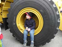 03-Kenny_sitting_in_a_big_tire