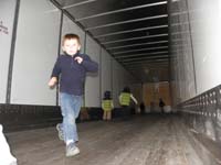 08-Kenny_running_in_the_tracker_trailer-warmer_in_there_than_outside