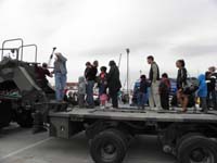 18-waiting_in_line_on_the_bed_of_a_military_truck_designed_to_transport_tanks
