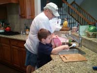 07-Kenny_and_Grandpa_Duke_doing_dishes