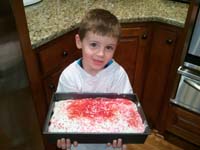 24-Kenny_decorated_Grandpa_Duke's_birthday_cake-sprinkles_overload