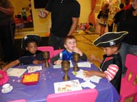 26-the_boys_congregate_on_one_end_of_the_table