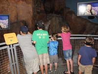 17-Kenny_watching_the_flash_flood_exhibit-now_he's_not_afraid_of_it