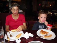 16-Baba_and_Kenny_eating_birthday_pizza_at_Streets_of_New_York