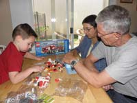 03-Kenny_Baba_and_Poppy_putting_together_phase_1_of_the_Lego_fire_truck
