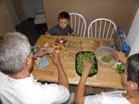 42-back_home_to_work_on_the_Lego_truck_while_Baba_peels_the_peas