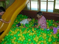 17-Baba_and_Kenny_playing_in_the_ball_pit
