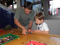48-Daddy_helping_Kenny_build_a_Lego_racer