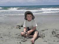 18-Kenny_playing_in_the_wet_sand