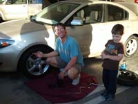 34-Daddy_changing_damaged_tire_in_MGM_Grand_parking_garage-thanks_Uncle_Tommy