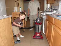 23-Kenny_vacuuming_up_after_himself-lots_of_rubber_balls_from_soccer_field