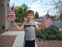 02-patriotic_Kenny-putting_out_flags_on_4th_of_July