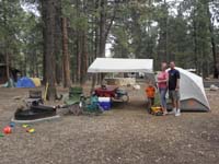 07-family_at_our_campsite-situated_for_potential_rain-rained_each_night