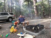 24-Kenny_and_Daddy_with_pizzas_cooking_on_the_campfire