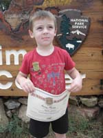 79-Kenny_and_his_junior_ranger_certificate_and_badge