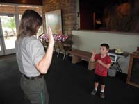 14-Kenny_getting_sworn_in_as_a_junior_ranger-we_took_some_of_that_vegis_behind_Kenny