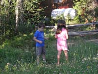 06-Kenny_and_Sierra_in_meadow_by_campsite-probably_filled_with_mosquitoes-Kenny_eventually_got_bitten_badly