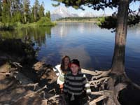 16-Sierra_and_Kenny_at_the_tree_by_the_lake