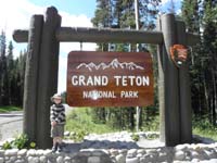 72-Kenny_with_Grand_Tetons_National_Park_entrance_sign