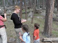 12-kids_working_on_the_junior_ranger_program_with_parent's_help