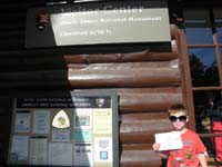 23-Kenny_wearing_Mommy's_sunglasses_with_Junior_Ranger_certificate_and_badge