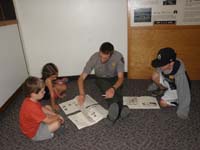 12-reviewing_Junior_Ranger_book_with_Ranger