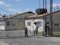 05-Kenny_and_Daddy_at_secured_entrance-waiting_for_tour_to_start-that_door_is_exit_for_control_room_access