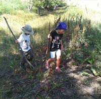 19-Sierra_and_Kenny_having_fun_in_the_grass_while_Daddy_Toby_and_Joel_hike
