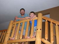 18-Daddy_and_Kenny_at_the_top_of_the_stairs_in_the_cabin