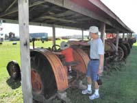 77-he_wanted_to_sit_on_all_the_tractors-and_he_almost_did_sit_in_all_of_them