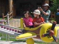 79-Kenny_and_Brooke_flying_a_plane-Daddy_ready_to_take_pictures