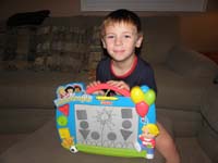 26-Kenny_shows_off_the_flower_he_drew_for_Mommy