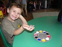 35-Kenny_shows_off_the_rock_he's_going_paint
