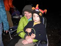 10-Mommy_and_Kenny_sitting_in_a_chair_watching_the_fire