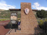 11-Kenny_at_Kolob_Canyons_Zion_National_Park_entrance_sign_with_badge