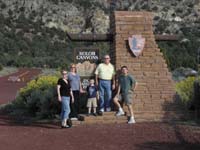 12-family_at_Kolob_Canyons_Zion_National_Park_entrance_sign