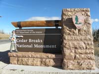 16-next_morning-Kenny_at_Cedar_Breaks_National_Monument_sign-forgot_stuffed_animals_so_Grammy_bought_a_couple