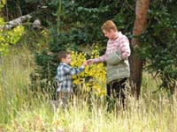 34-Kenny_gives_Mommy_an_aspen_leaf