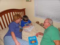 01-Kenny_reads_to_Grammy_and_Grandpa_Duke