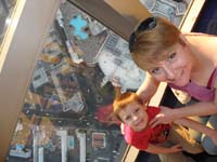 20-Kenny_and_Mommy_watching_people_jump_off_the_building-we'll_try_it_someday