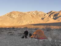058-Peppe_and_his_tent_with_setting_sun_illuminating_mountain