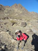 073-Kenny_takes_one_of_many_rests_on_the_trail-his_feet_hurt_because_they_are_still_cold