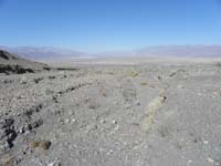 145-looking_down_wash_to_Hwy_190_and_mountains_beyond