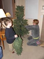 29-Kenny_helping_Mommy_put_up_the_Christmas_tree
