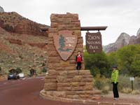 02-Kenny_and_Mommy_in_front_of_entrance_sign_for_Zion_National_Park